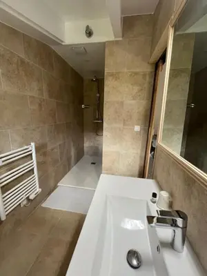 a bathroom with a white sink and a shower at Auberge du col saint Georges in Grosseto-Prugna