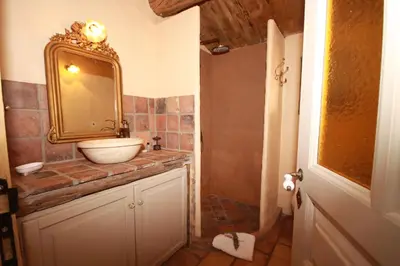 a bathroom with a sink and a mirror at Auberge U Sirenu in Sartène