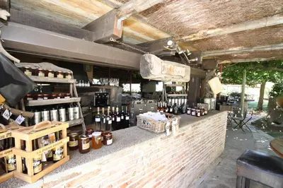 a store with a counter with bottles of wine at Auberge U Sirenu in Sartène