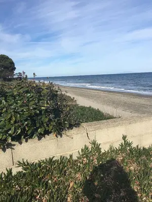 a sandy beach with the ocean in the background at Villa E Lecce in Santa-Lucia-di-Moriani