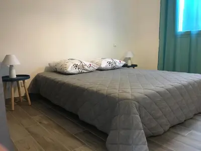 a bedroom with a bed with two pillows on it at Villa E Lecce in Santa-Lucia-di-Moriani
