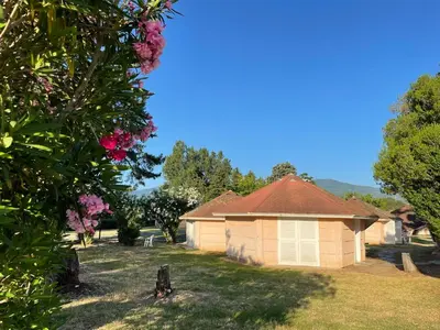 a small building in the yard of a house at Le Village des Isles in Taglio-Isolaccio