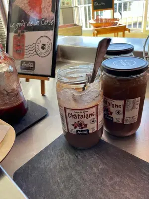 two jars of peanut butter and jelly on a counter at Le Village des Isles in Taglio-Isolaccio