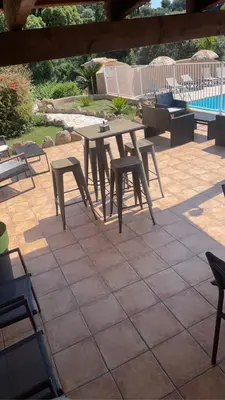 a picnic table and chairs on a patio at Residence 