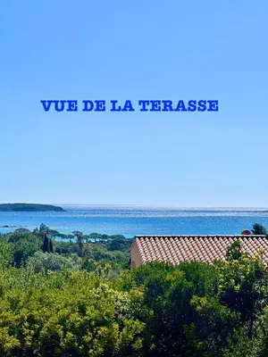a sign that reads va la taza tortrescens with the ocean at Résidence U LATONU - Palombaggia in Porto-Vecchio