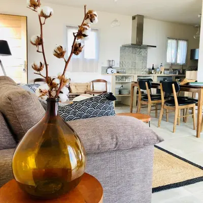 a yellow vase sitting on a table in a living room at Les Villas MarInCelu in Porto Pollo