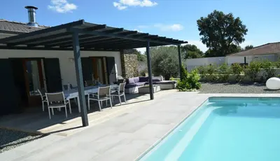 a patio with a swimming pool and a pergola at A Sulana Chambre d'hôtes in Valle-di-Campoloro