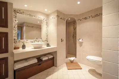 a bathroom with a sink and a toilet and a mirror at locations calenzana in Calenzana