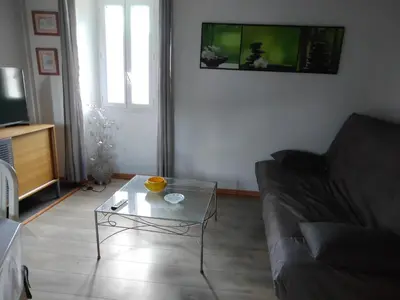 a living room with a couch and a coffee table at Maison Lisa Maria in Ponte-Leccia