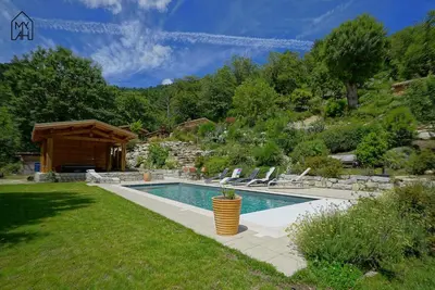 a swimming pool in a yard with a house at Bergerie avec piscine in Tasso