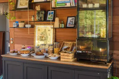 a counter with food and a microwave on it at Les Jardins de Mathieu in Porto-Vecchio