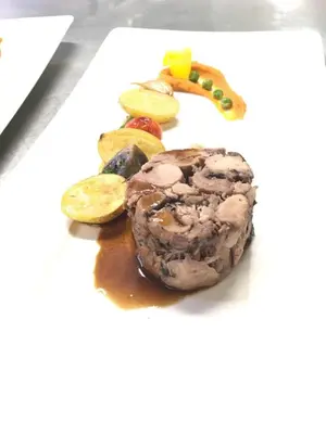 a plate of food with meat and vegetables on it at Sole E Monti in Quenza