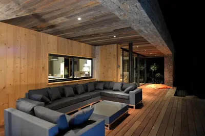 a living room with a couch and a table at Les lofts de palombaggia in Porto-Vecchio