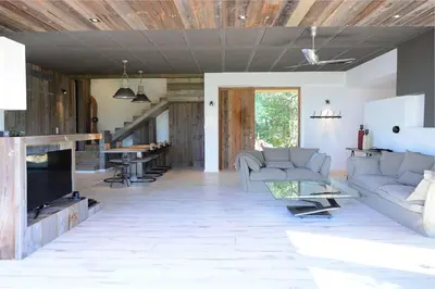 a living room with a couch and a table at Les lofts de palombaggia in Porto-Vecchio