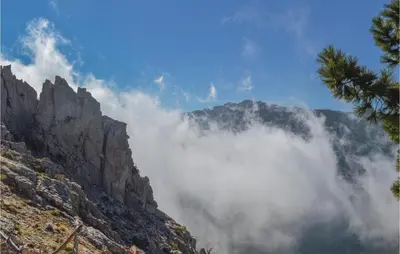 a mountain with clouds in front of it at 1 Bedroom Cozy Apartment In Zonza in Zonza