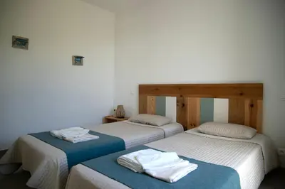two beds sitting next to each other in a room at Villa Giulia in Porto-Vecchio
