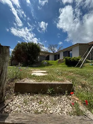a yard with a house in the background at Villa Giulia in Porto-Vecchio