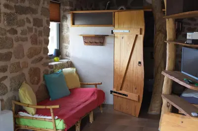 a small room with a small table and a chair at Casa Lysandra in Serra-di-Ferro