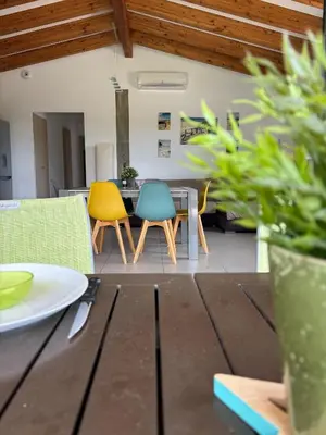 a dining room with chairs and a table at Villa Santa in Porto-Vecchio