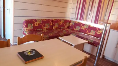 a living room with a couch and a table at La Canardiere in Casta