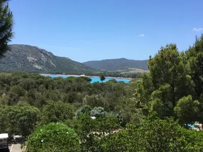 a view of a lake from the hills at Villa Les Hameaux Di Santa Giulia in Porto-Vecchio