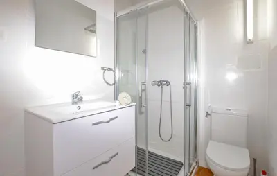 a bathroom with a shower and a sink and a toilet at Villa Nicolas in Coti-Chiavari