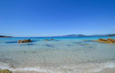 a beach with some rocks in the water at Villa Saint Nicolas in Coti-Chiavari