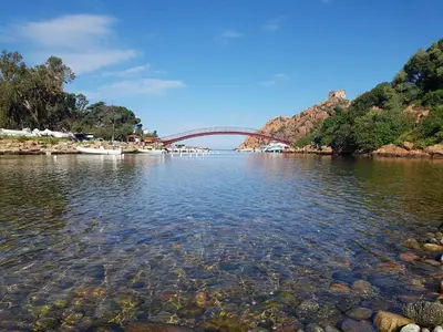 a bridge over a body of water at Le Marina in Porto Ota