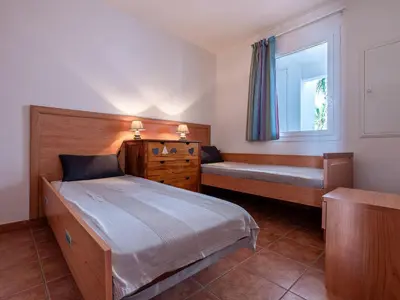 a bedroom with a bed and a window at Apartment Casa Vecchi by Interhome in Moriani Plage