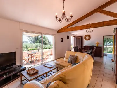 a dining room with a wooden table and chairs at Holiday Home Maison Christian by Interhome in Cervione