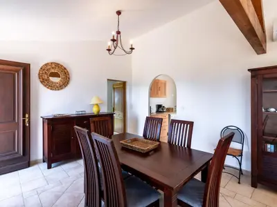 two beds in a bedroom with blue walls at Holiday Home Maison Christian by Interhome in Cervione
