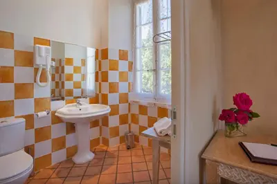 a bathroom with a sink and a toilet at Mare E Monti - Hôtel de Charme in Feliceto