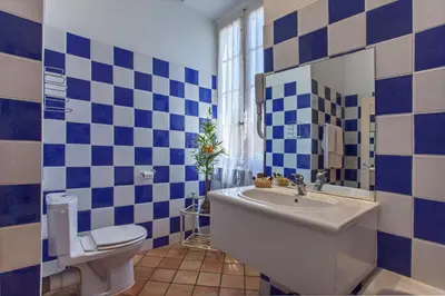 a bathroom with a tub and a toilet and a sink at Mare E Monti - Hôtel de Charme in Feliceto