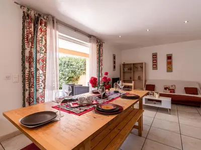 a dining room with a table with plates and glasses at Villa Gelormini-2 by Interhome in Prunelli-di-Fiumorbo