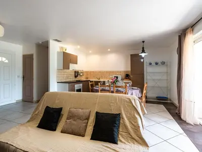 a living room with a bed and a kitchen at Villa Gelormini-1 by Interhome in Prunelli-di-Fiumorbo