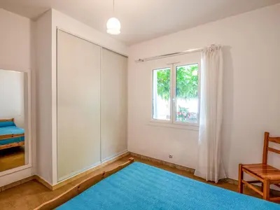 an empty room with a blue rug and a window at Holiday Home Dami I-1 by Interhome in Santa-Lucia-di-Moriani