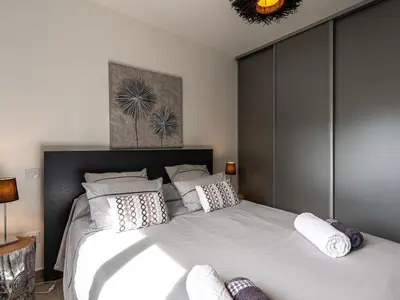 a bedroom with a large white bed with pillows at Holiday Home Villa Marie-Jo by Interhome in Cervione