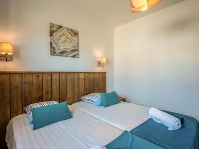 two beds in a bedroom with two pillows at Holiday Home Villa Marie-Jo by Interhome in Cervione