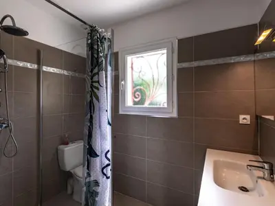 a bathroom with a sink and a window at Holiday Home Villa Marie-Jo by Interhome in Cervione