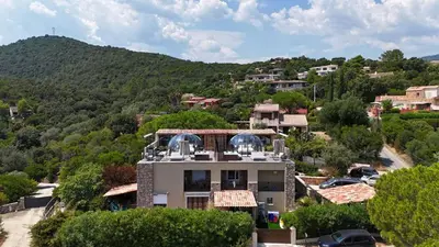 a house in the middle of a mountain at La Villa in Favone