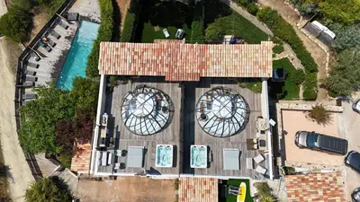 an overhead view of a building with a swimming pool at La Villa in Favone