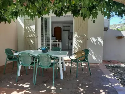 a table and chairs sitting on a patio at Domaine de la Punta in Porto-Vecchio