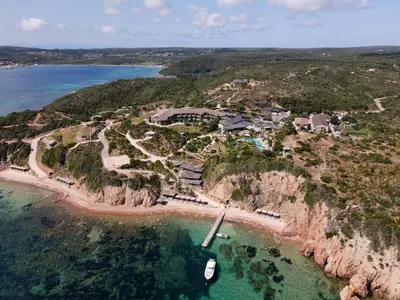 an aerial view of a resort on a rocky coast at U Capu Biancu in Bonifacio