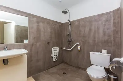 a bathroom with a toilet and a sink at Kilina in Porto-Vecchio