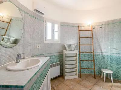 a bathroom with a sink and a mirror and a ladder at Apartment Casa Marcelli by Interhome in SantʼAntonino