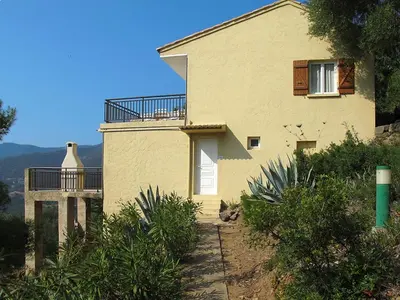 a house with a balcony on the side of it at Apartment Aloes by Interhome in Partinello