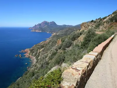 a retaining wall on a cliff next to the ocean at Apartment Aloes by Interhome in Partinello