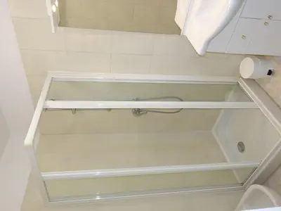 a bathroom with a bath tub with a toilet at Apartment Camelia- Marjolène by Interhome in Partinello