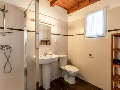 a bathroom with a toilet and a sink and a shower at Holiday Home La Pinède- bungalow 4 pers- by Interhome in Sagone