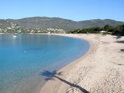 a shadow of a person on a beach at Holiday Home La Pinède- bungalow 6 pers- by Interhome in Sagone